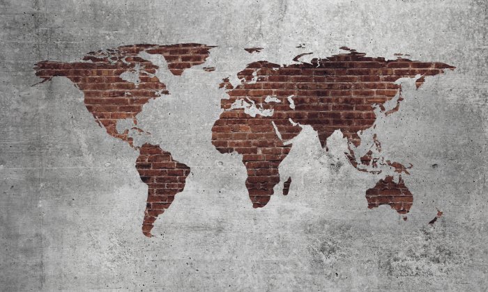 Fototapete Weltkarte aus rotem Backstein auf strukturiertem Hintergrund