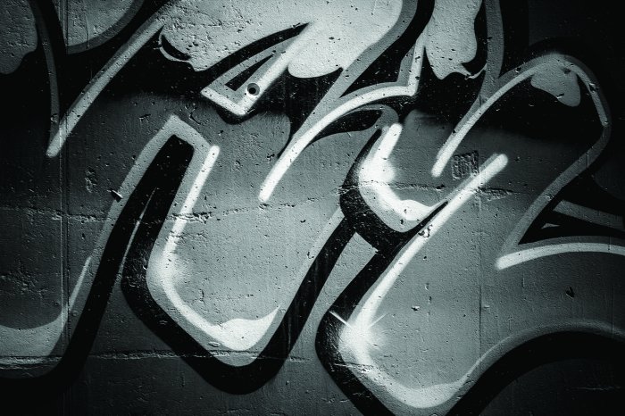 Fototapete Schwarz-weißes Graffiti an einer Betonwand