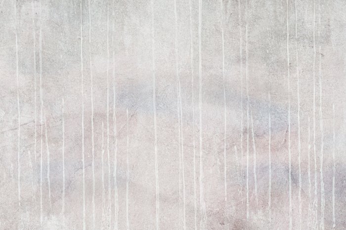 Fototapete Sanft herabfließende Farbe auf Beton