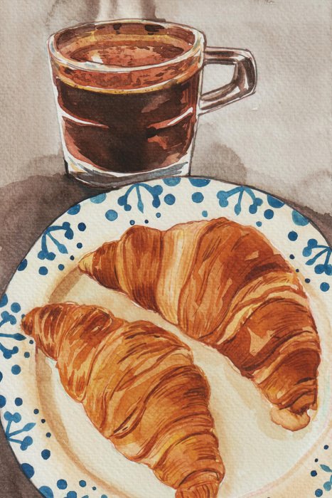 Bild Ein dekorativer Teller mit Croissants und eine Tasse schwarzer Kaffee