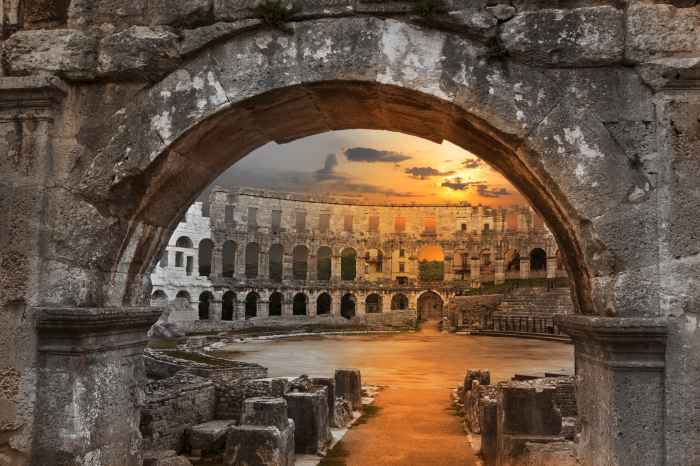 Poster Sonnenuntergang über antiker Architektur