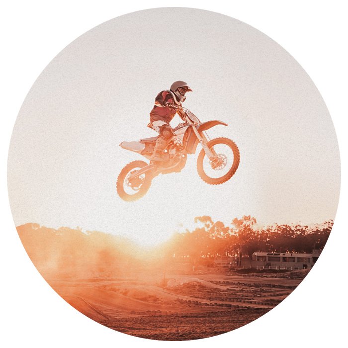 Sticker Motocross-Fahrer vor dem Hintergrund des Sonnenuntergangs