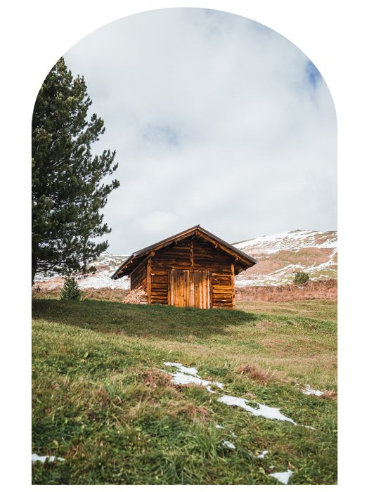 Sticker Berglandschaft mit einer Holzhütte