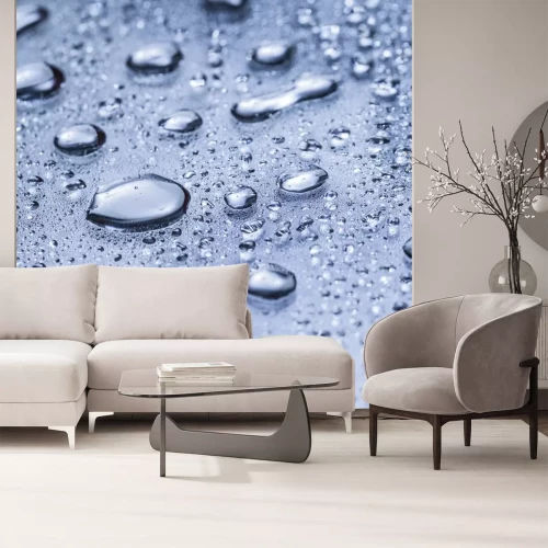 Sticker Wassertropfen auf einem blauen Oberfläche