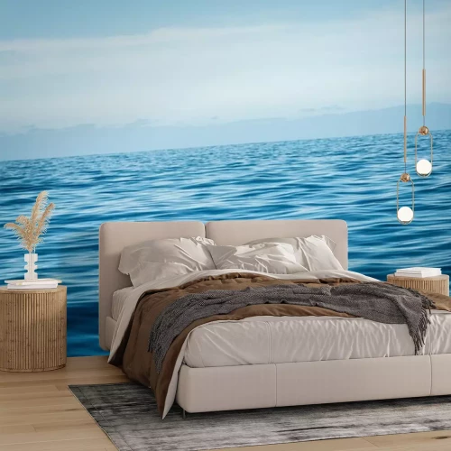 Fototapete Ruhiges Meerwasser vor dem Himmel