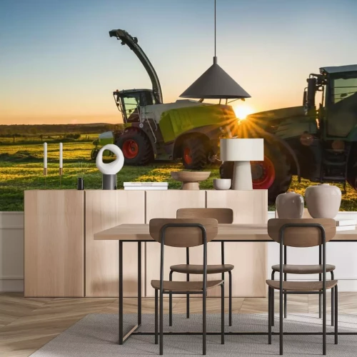 Fototapete Traktor und Erntemaschine bei Sonnenuntergang