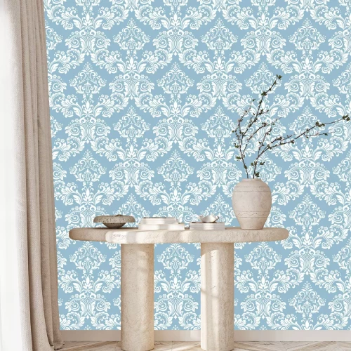 Tapete Motiv mit weißem Ornament auf hellblauem Hintergrund