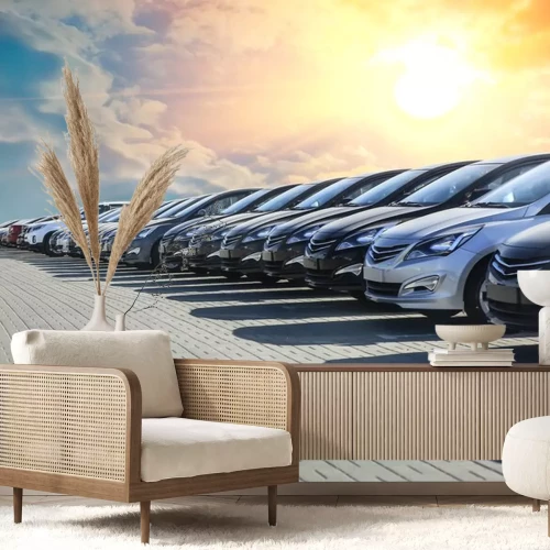 Sticker Eine Reihe geparkter Autos im Schein der untergehenden Sonne