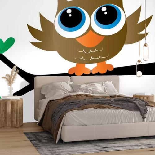 Sticker a cute little brown owl sitting on a branch