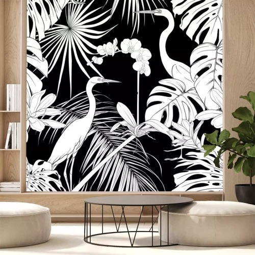 Sticker Schwarz-weiße Vögel inmitten tropischer Pflanzen