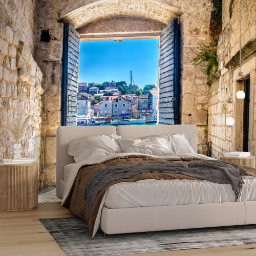 Fototapete Ein Tor mit Blick auf eine mediterrane Stadt