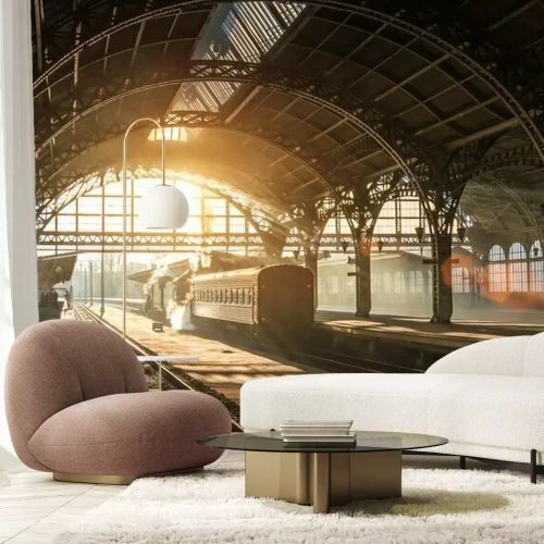 Fototapete Old railway station with a train and a locomotive on the platform awaiting departure. Evening sunshine rays in smoke arches.