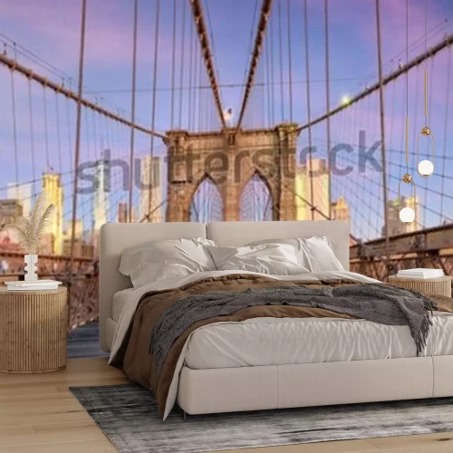 Fototapete New York, New York on the Brooklyn Bridge Promenade facing Manhattan's skyline at dawn.