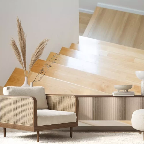 Sticker The design of staircase inside the house are paved with light brown wood laminate.