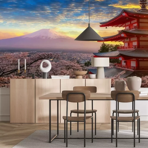 Fototapete Sonnenuntergang vor Bergen und Kirschblüten