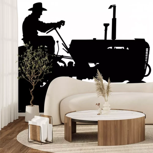 Sticker A vector silhouette of an old farmer driving an old tractor.