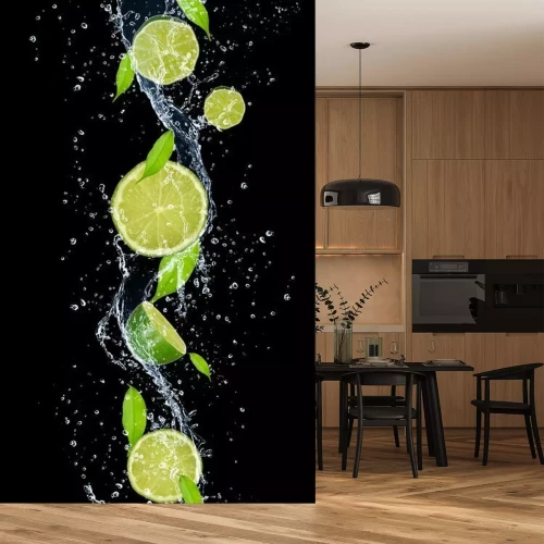 Fototapete Limonen im Wasser auf schwarzem Hintergrund