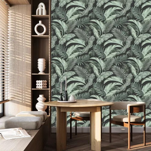 Tapete Getönte grüne Blätter auf schwarzem Hintergrund