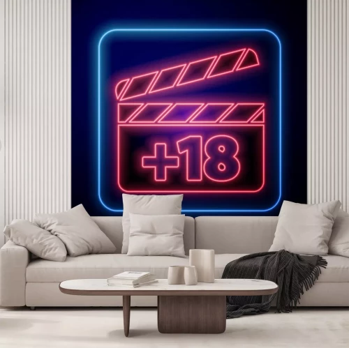 Sticker Glowing neon Movie clapper with 18 plus content icon isolated on blue background. Age restriction symbol. Adult channel. Vector Illustration