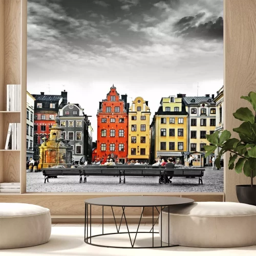 Fototapete Bunte Häuser unter schwarz-weißem Himmel