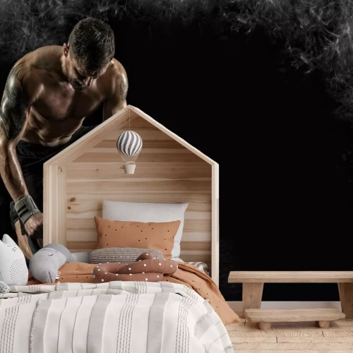 Fototapete Muskelbepackter Sportler, der mit einer Girja trainiert