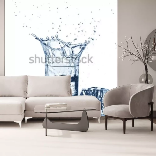 Fototapete Water splash in glass of blue color