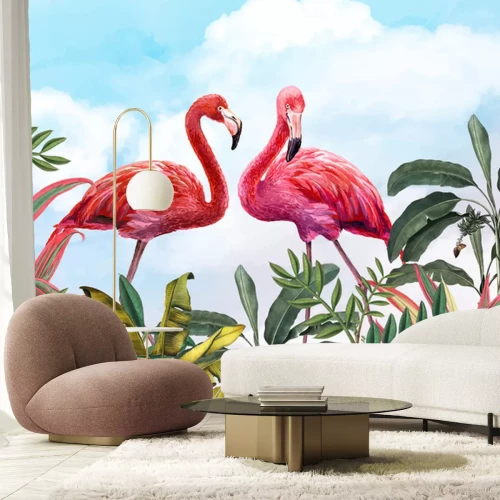 Fototapete Flamingos und tropische Blätter gegen den Himmel