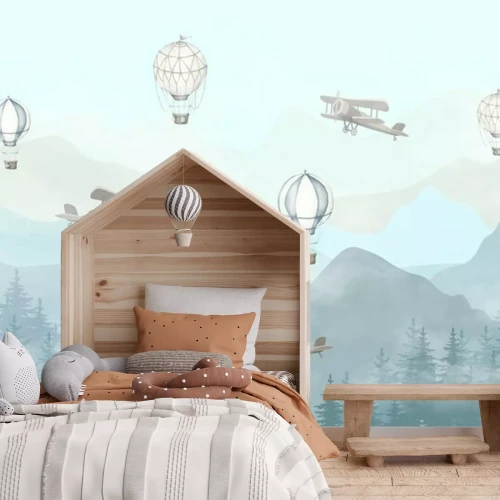 Fototapete Illustration of flying planes and balloons with a blue background. Slightly misty forest and high mountains. Kids wallpaper style.