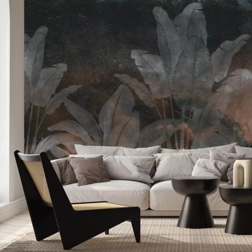 Fototapete Tropische Pflanzen auf einer dunklen Betonwand