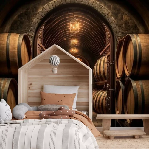 Fototapete A tunnel with wine barrels in it and a light hanging from the ceiling above it and a brick floor and a brick wall with a light fixture on the ceiling above it and a brick.