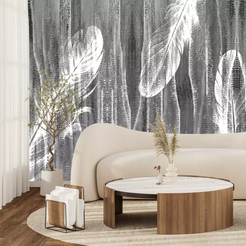 Fototapete Federn auf einem grauen strukturierten Hintergrund