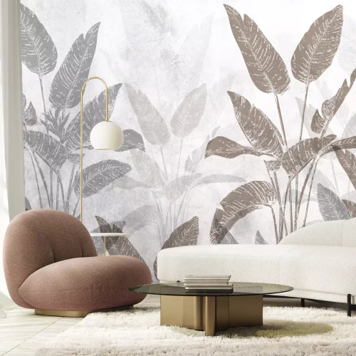 Fototapete Strelitzia große tropische Pflanzen auf einem Betonhintergrund