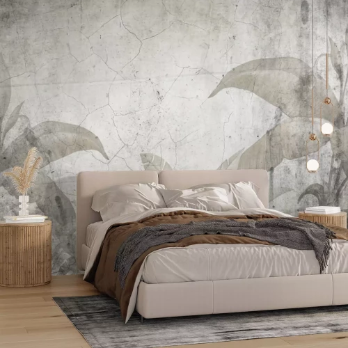 Fototapete Tropische Pflanzen vor einem Hintergrund aus rissigem Beton