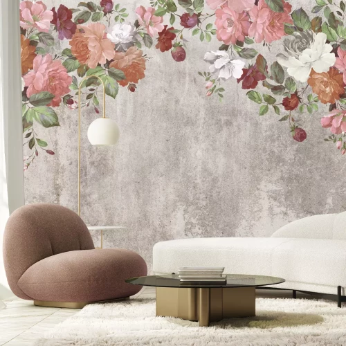 Fototapete Bunte Blumen hängen von oben vor einem Betonhintergrund