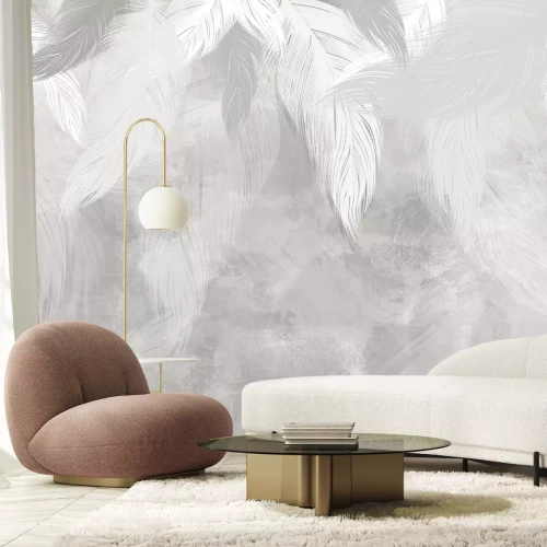 Fototapete Federn auf grauem Betongrund