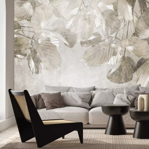 Fototapete Tropische Blätter auf Beton in Grautönen