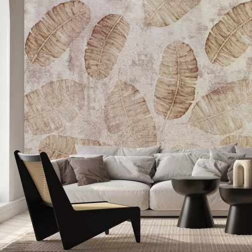 Fototapete Große Blätter auf grauem Betongrund