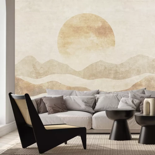 Fototapete Die Sonne geht hinter einer Berglandschaft unter