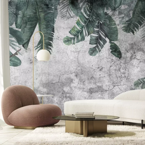 Fototapete Hängende tropische Blätter an einer dunkelgrauen Betonwand