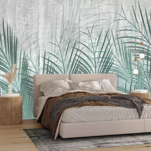 Fototapete Grüne Palmblätter auf grauem Betongrund