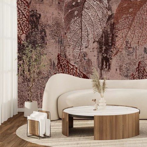 Fototapete Blätter auf einem strukturierten Betonhintergrund