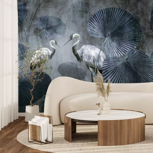 Fototapete Weiße Kraniche zwischen tropischen Blättern