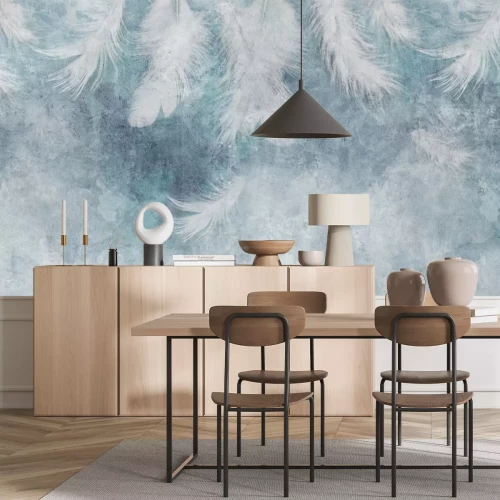 Fototapete Federn auf blauem Betongrund