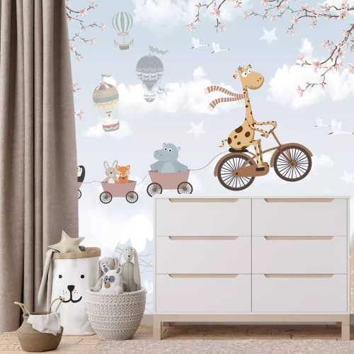 Fototapete Bergiges Land mit einer Giraffe auf einem Fahrrad