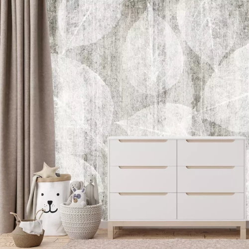 Fototapete Subtile Blätter auf einem Kartonhintergrund in Grautönen