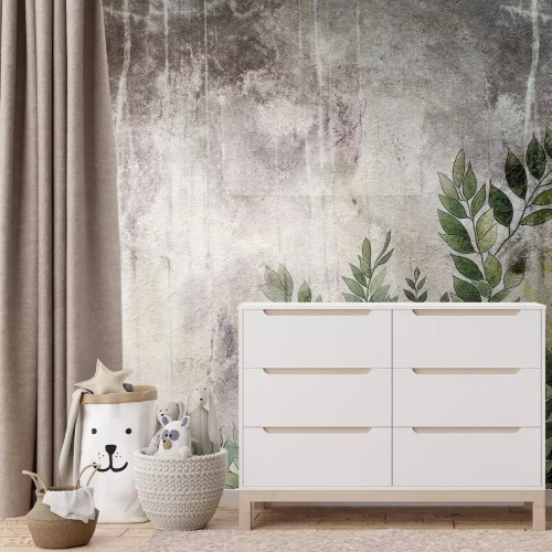 Fototapete Grüne Blätter auf grauem Beton