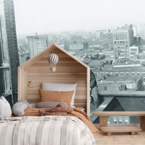 Fototapete Männer auf einer Metallkonstruktion vor der Stadtkulisse