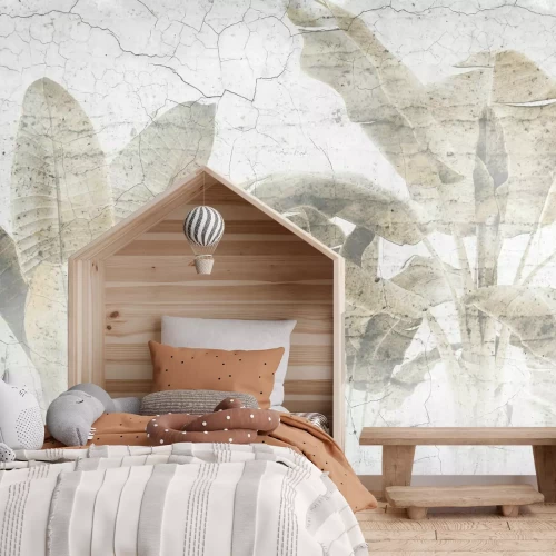 Fototapete Palmblätter an einer Betonmauer