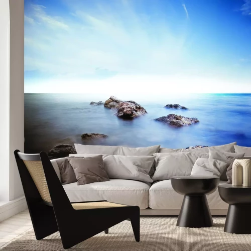 Fototapete Felsen auf einem nebligen Meer