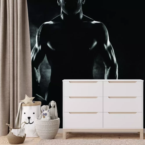 Fototapete Muskulöser Mann mit Boxhandschuhen